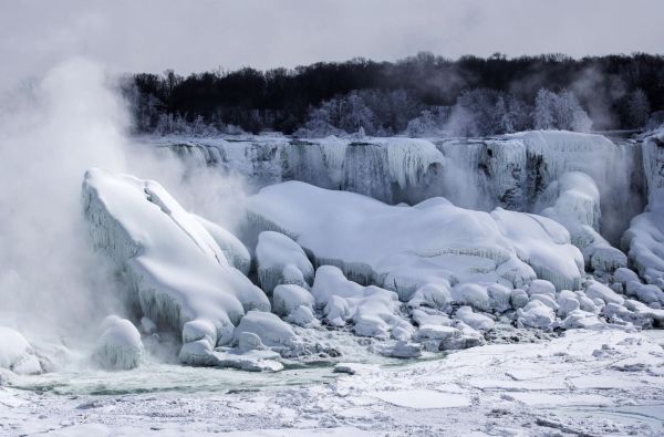 Frozen Niagara Falls bathed in colors day