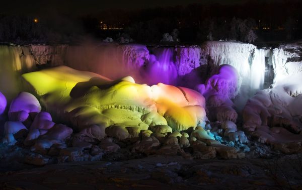 Frozen Niagara Falls bathed in colors m