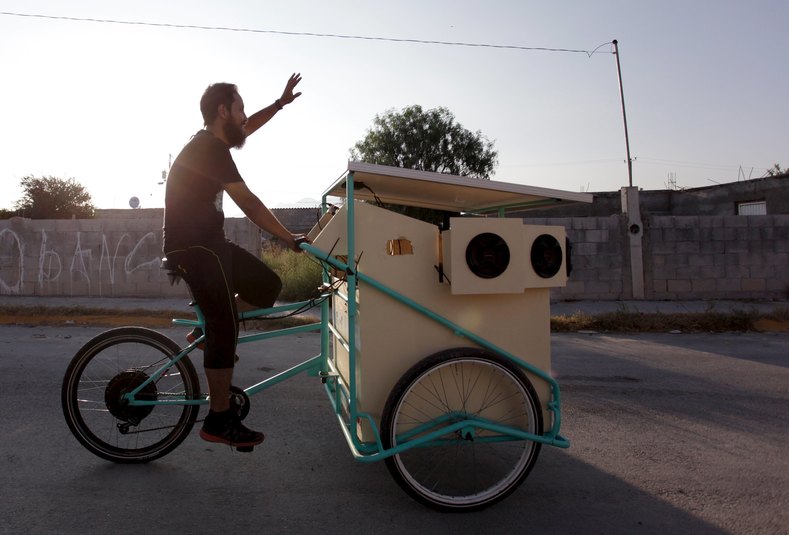 Reginaldo Chapa pedals his Cinecleta, Moviebike, through the streets of Saltillo
