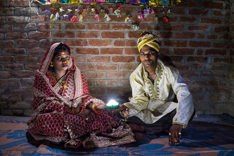 Holding a solar-powered lamp