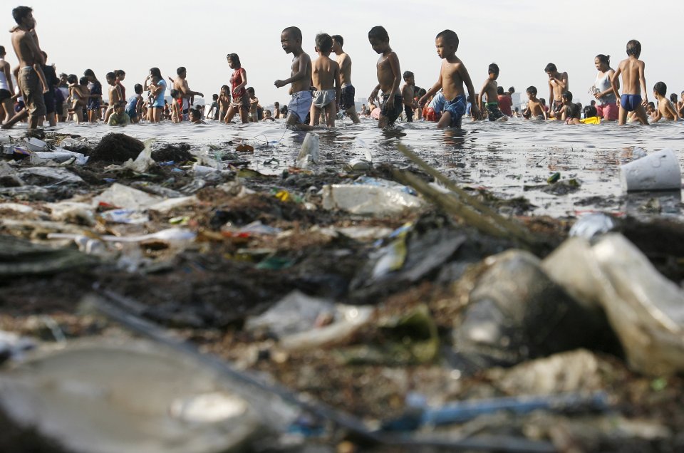 garbage-filled Manila Bay in the Philippines