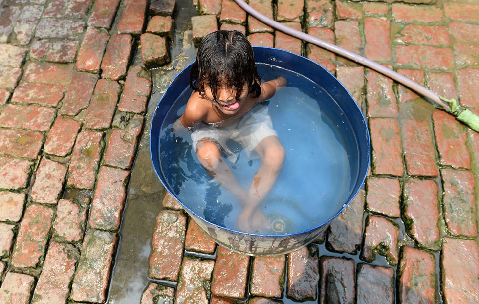 Bathing in contaminated water in Gangnauli village in Uttar Pradesh