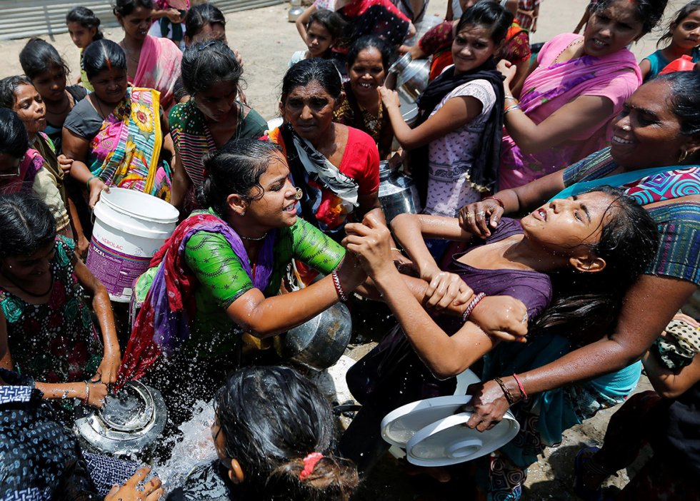 Women fight over drinking water from a municipal tanker in Ahmadabad