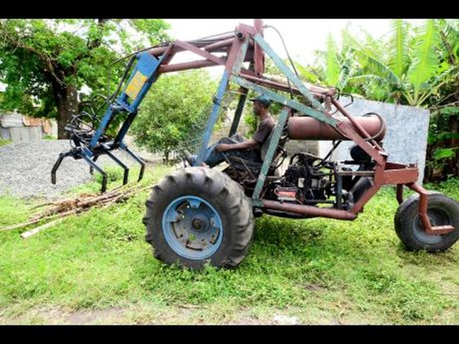 jamaican man builds cane loader out of scrap
