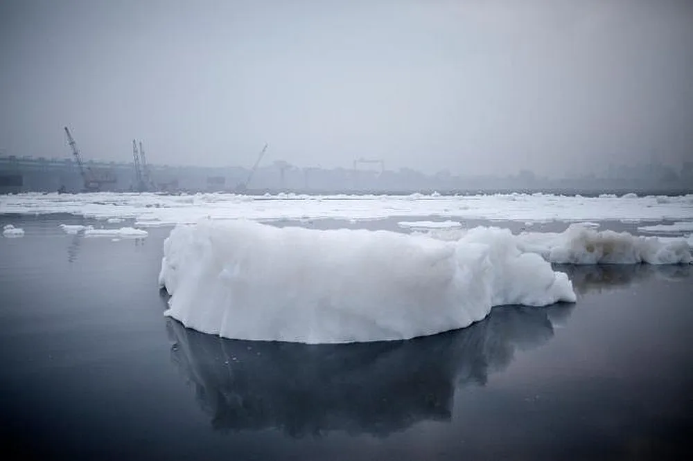 An iceberg of chemical waste dumped by factories along the Yamuna River