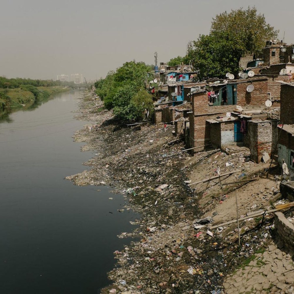 Housing next to open sewers in Noida