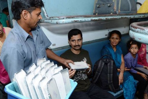 food getting served in plastic plates in indian railways