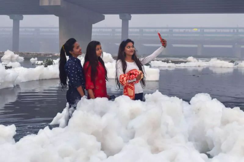 Devotees Performed Chhath Puja amidst Smog and Toxic Foam Waters of Yamuna