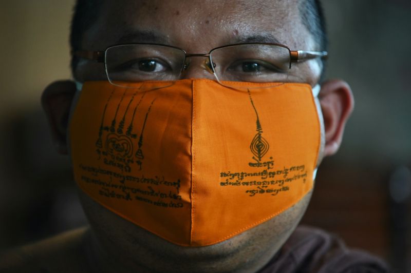 Amidst Coronavirus Buddhist Monks in Thailand Recycle Plastic to Make Face Masks