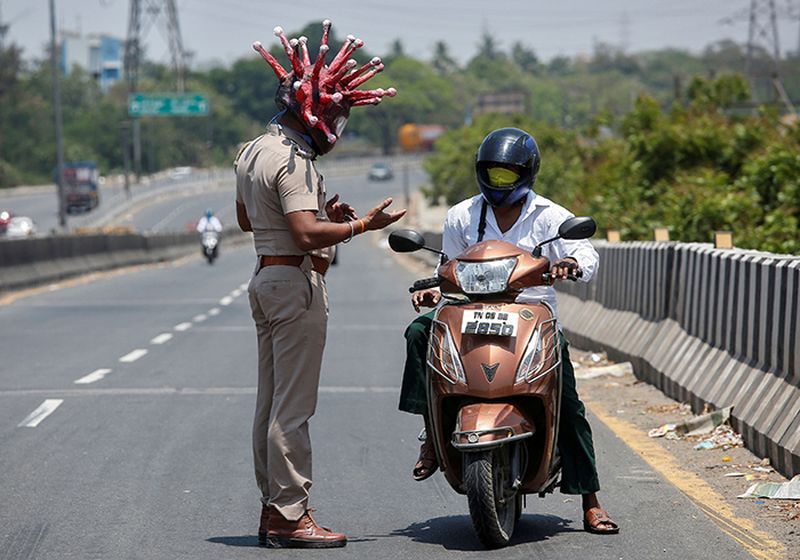 Police Officer Wears Coronavirus Helmet to Motivate People to Stay Inside During Lockdown
