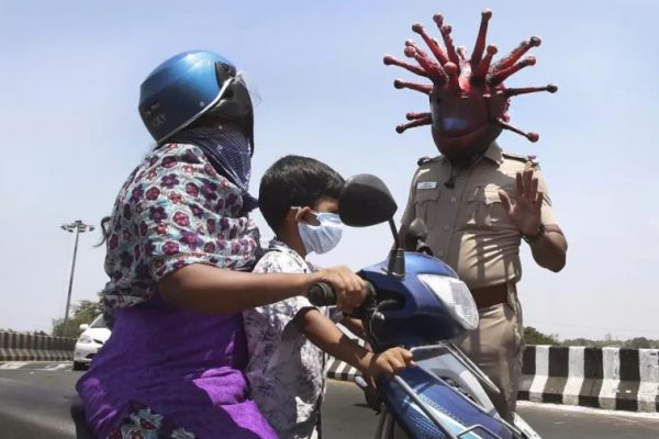 Police Officer Wears Coronavirus Helmet to Motivate People to Stay Inside During Lockdown