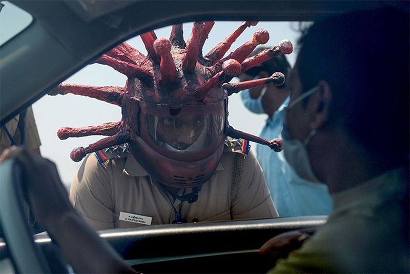 Police Officer Wears Coronavirus Helmet to Motivate People to Stay Inside During Lockdown