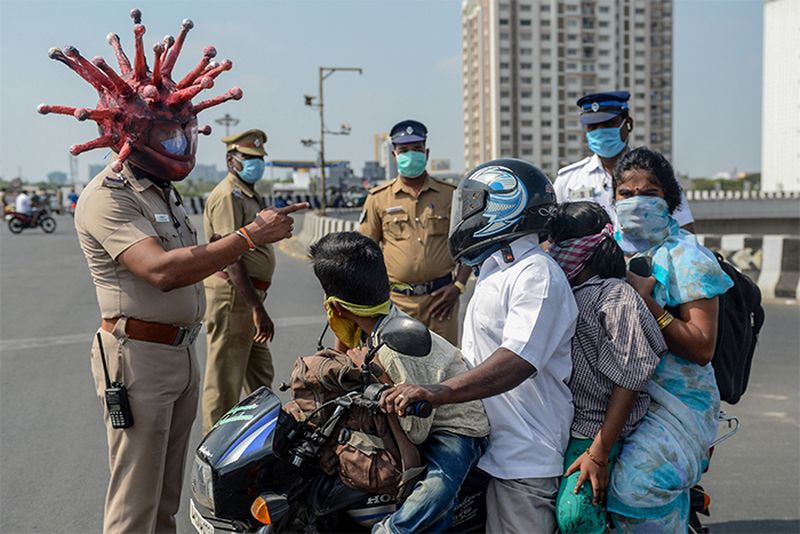 Police Officer Wears Coronavirus Helmet to Motivate People to Stay Inside During Lockdown