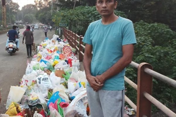 Man Stands beside Godavari to Stop People from Dumping Garbage into River