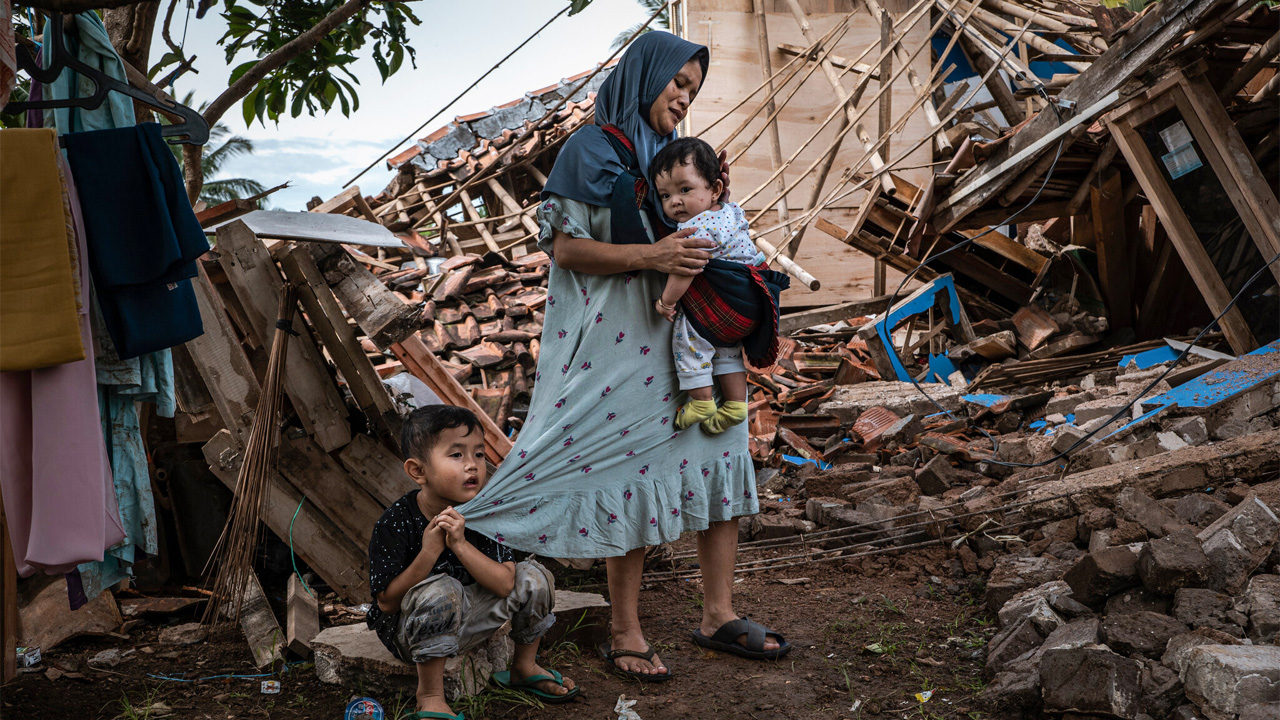 Distraught-family-after-a-5.6-magnitude-earthquake-flattened-tens-of-thousands-of-homes-in-Indonesia-in-November