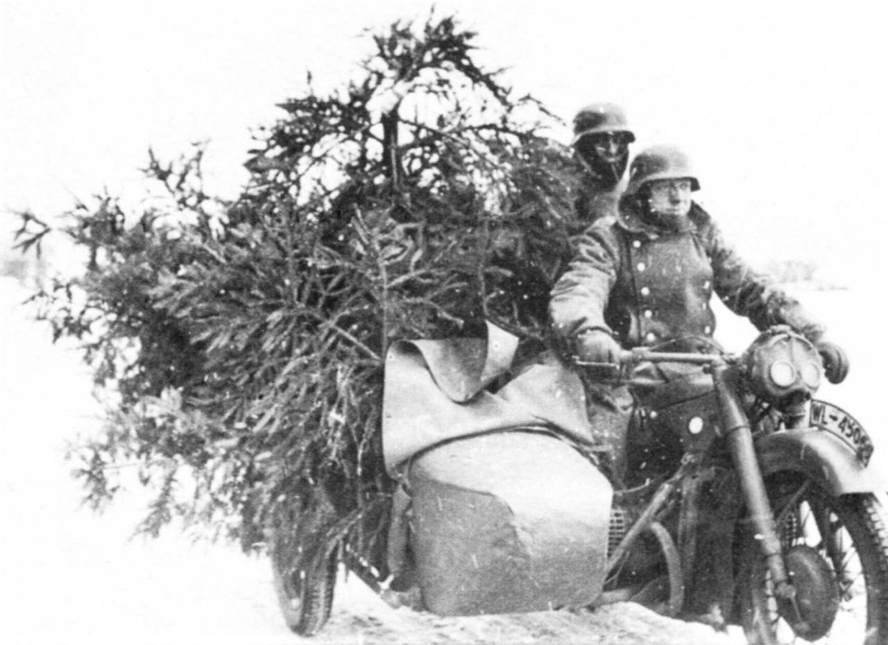 German soldiers carry Christmas trees on their BMW R12 motorcycle during WWII