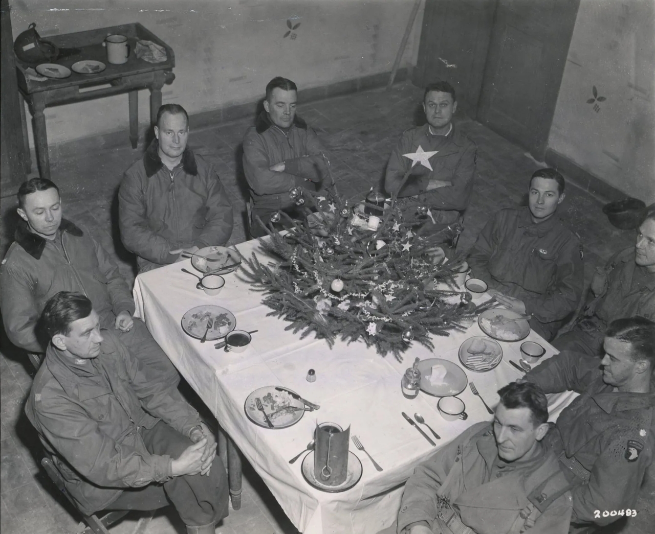 Officers of the 101st Airborne Division having Christmas dinner in Belgium under German Siege